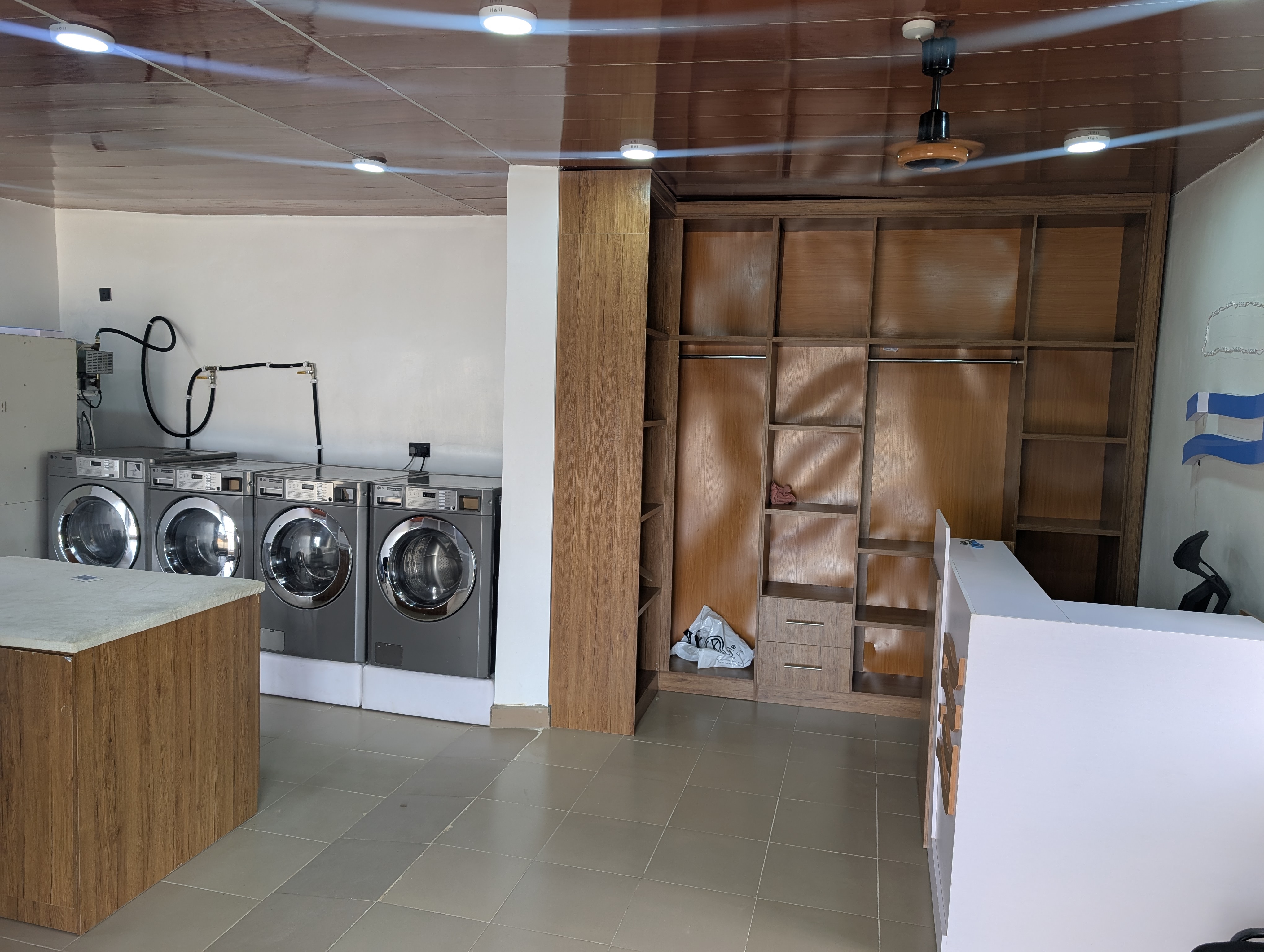 Modern washing machines inside Fabricare Laundromat